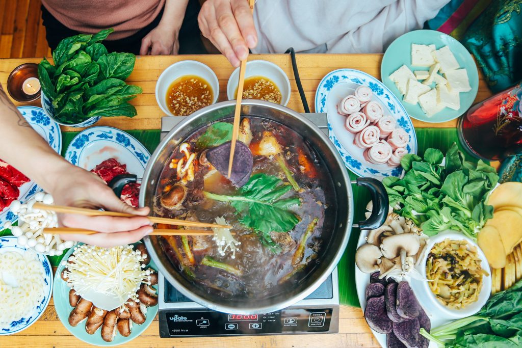 Sichuan Hot Pot with meats, vegetables, and tofu." 